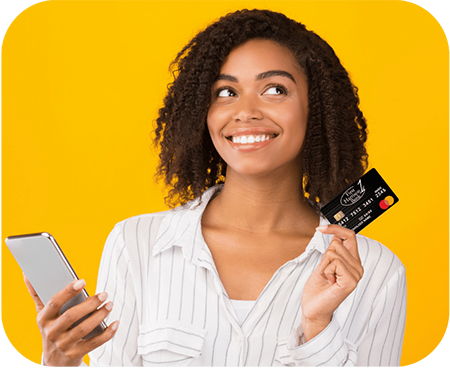 Woman holding a phone and First Harrison Bank debit card with a yellow background